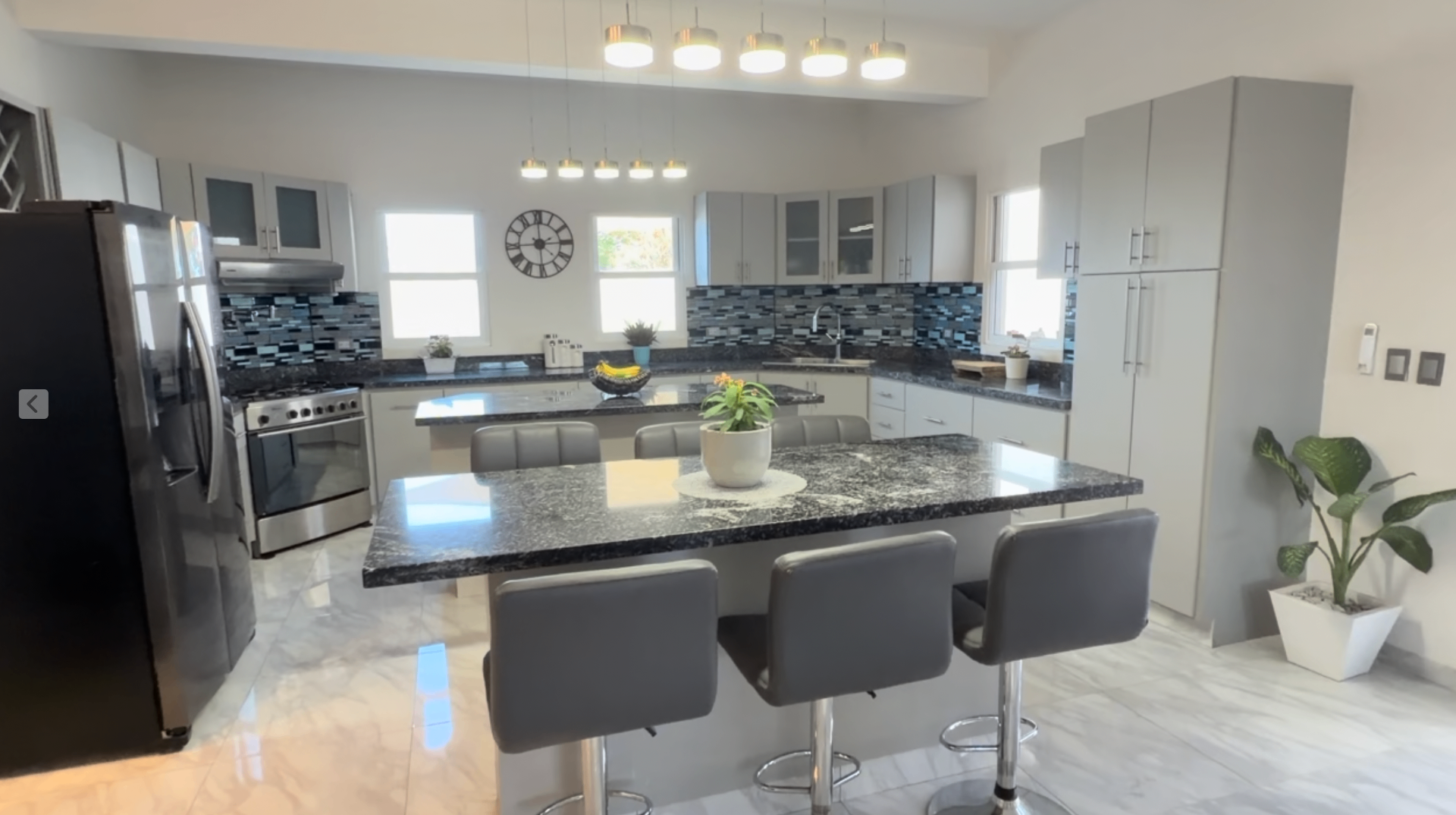 Kitchen with granite island and pendant lighting