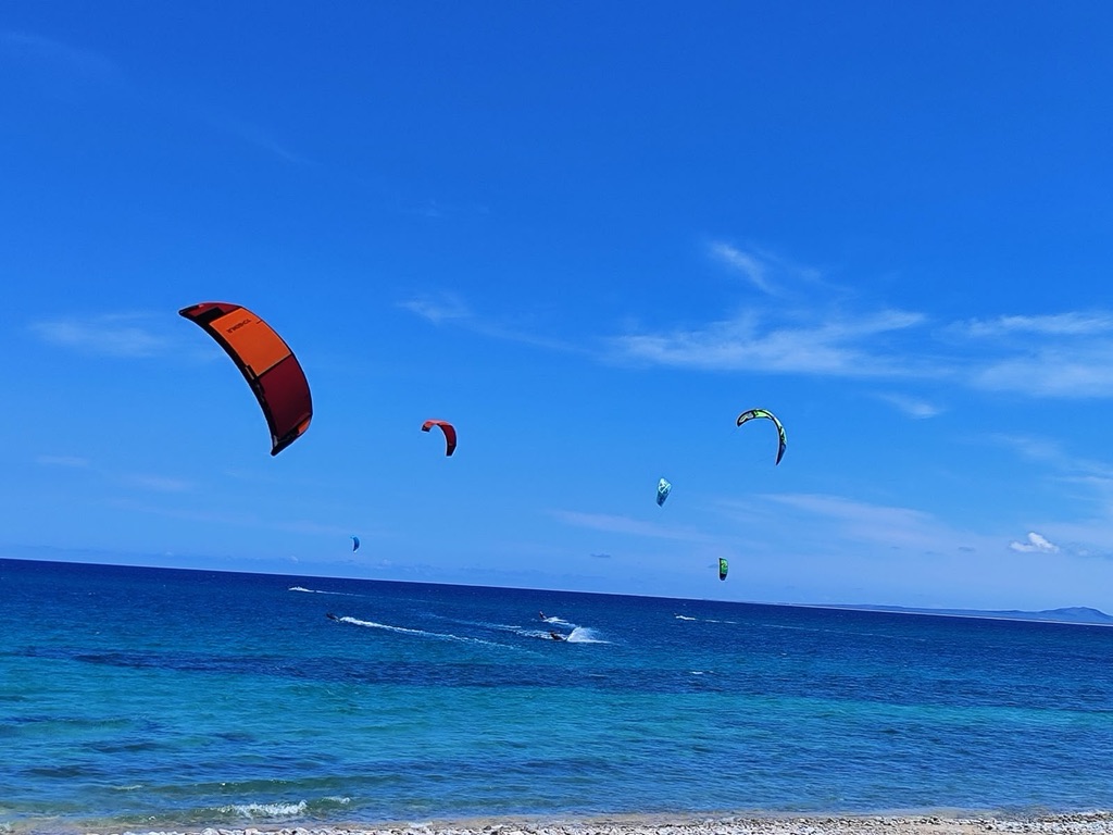 Kiteboarders on the turquoise Sea of Cortez at La Ventana