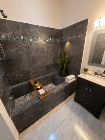 Master bath — stone tile and soaking tub